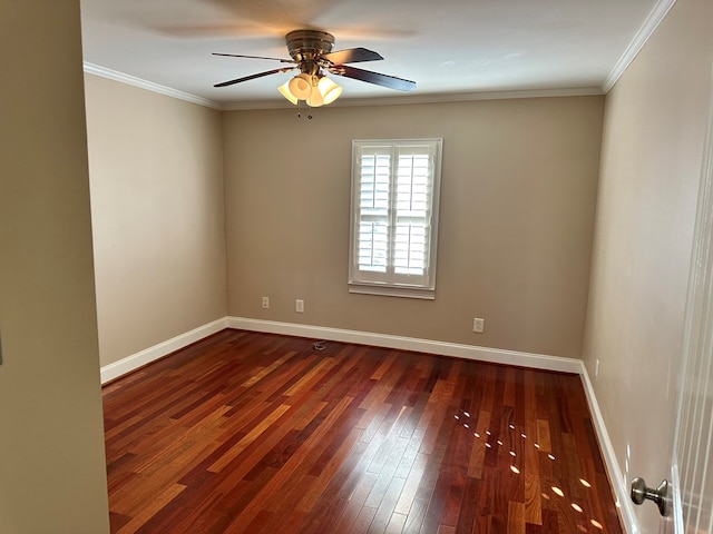 spare room with ornamental molding, dark hardwood / wood-style floors, and ceiling fan