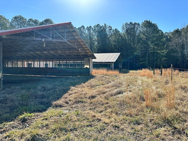 view of home's exterior featuring an outdoor structure