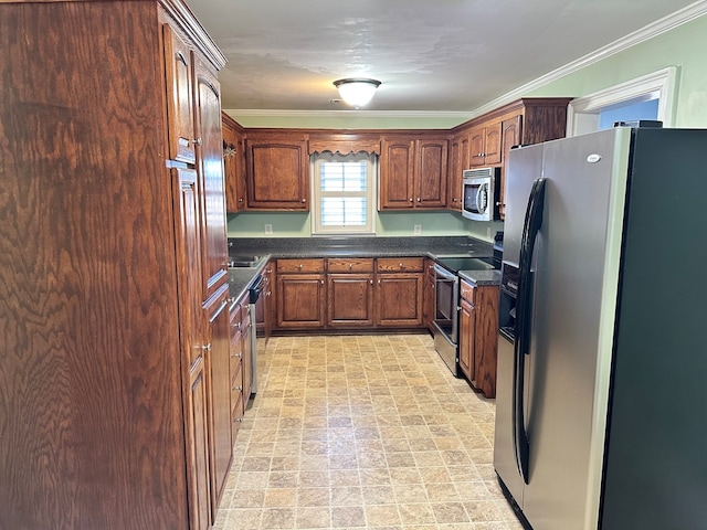 kitchen featuring ornamental molding and appliances with stainless steel finishes