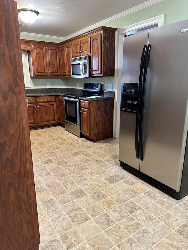 kitchen featuring ornamental molding and appliances with stainless steel finishes