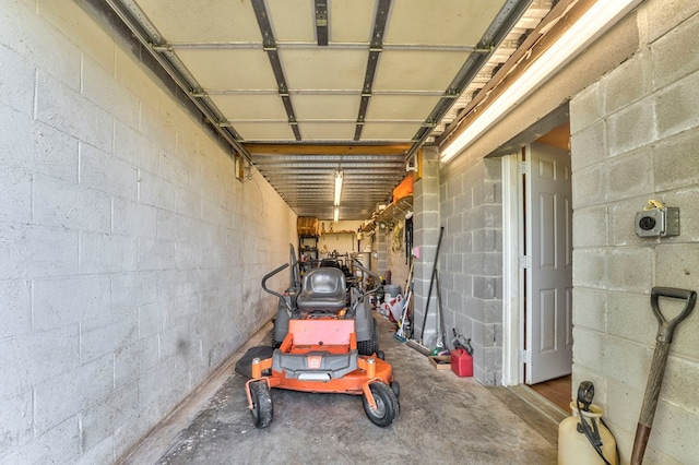 garage featuring concrete block wall