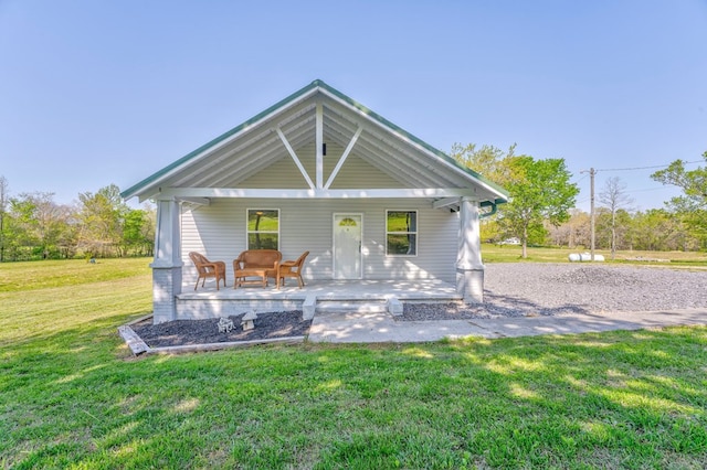 view of front of home featuring a porch and a front yard