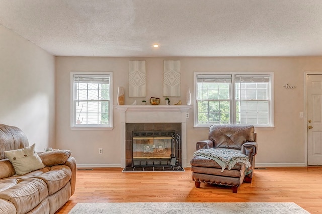 1962 Meadowbrook Cir, Dalton, GA 30720 - living room with wood finished floors, a fireplace, a textured ceiling, and recessed lighting
