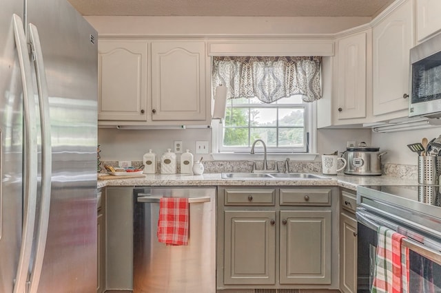 1962 Meadowbrook Cir, Dalton, GA 30720 - kitchen with appliances with stainless steel finishes, light countertops, and white cabinets