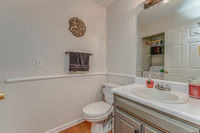 1962 Meadowbrook Cir, Dalton, GA 30720 - bathroom with vanity, washer / clothes dryer, and wood finished floors
