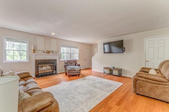 1962 Meadowbrook Cir, Dalton, GA 30720 - living room with a fireplace, wood finished floors, a textured ceiling, and recessed lighting