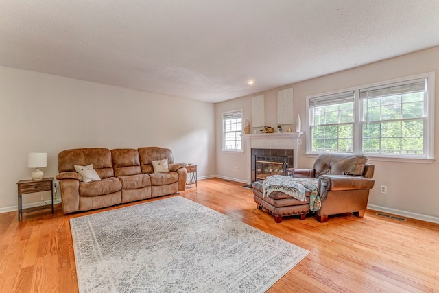 1962 Meadowbrook Cir, Dalton, GA 30720 - living room featuring wood finished floors and a tile fireplace