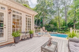 1603 Habersham Way, Dalton, GA 30720 - deck with an outdoor pool and view of wooded area