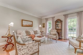 1603 Habersham Way, Dalton, GA 30720 - living area with healthy amount of natural light, light wood-type flooring, and ornamental molding