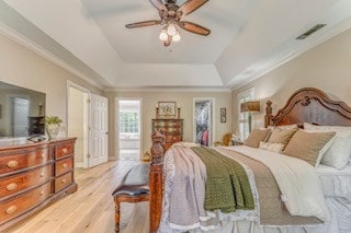 1603 Habersham Way, Dalton, GA 30720 - bedroom with light wood-style flooring, a tray ceiling, crown molding, and ceiling fan