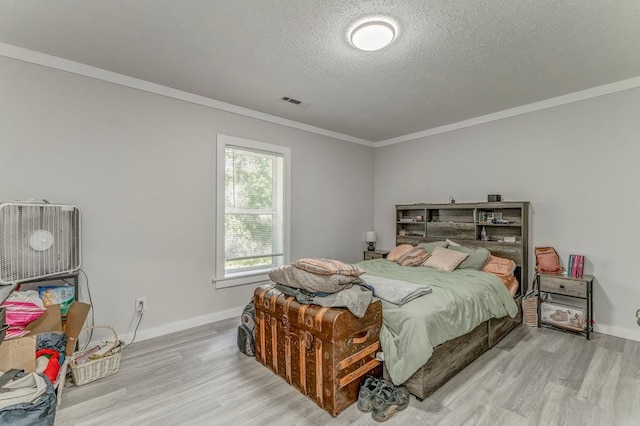 375 Weber Rd, Crandall, GA 30711 - bedroom featuring wood finished floors, ornamental molding, a textured ceiling, and baseboards