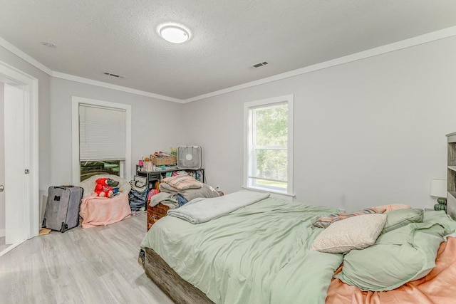 375 Weber Rd, Crandall, GA 30711 - bedroom with wood finished floors, ornamental molding, and a textured ceiling