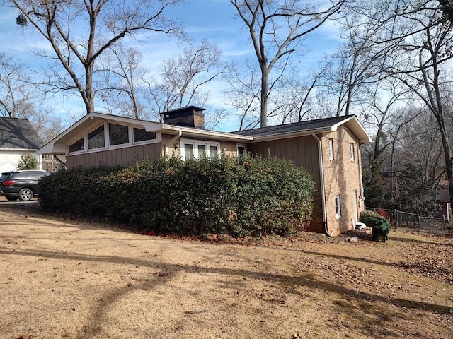 view of home's exterior with a yard