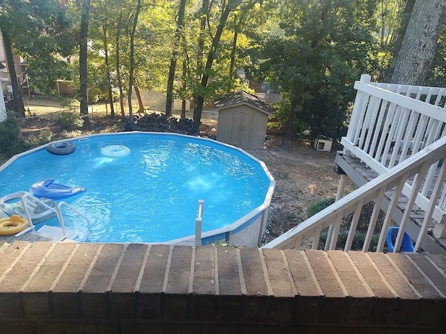 view of pool featuring a shed