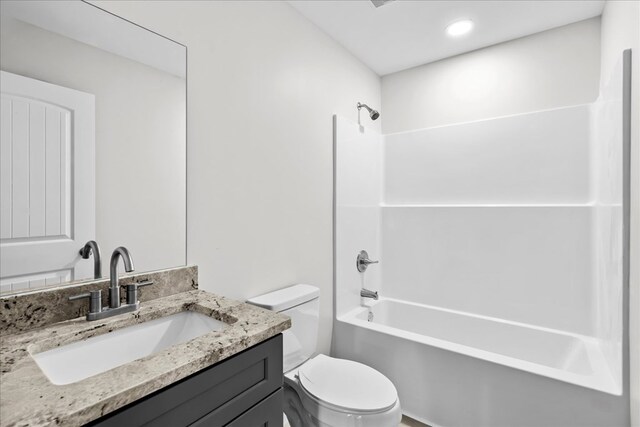 519 Abigail St, Dalton, GA 30721 - bathroom with toilet, vanity, shower / washtub combination, and recessed lighting