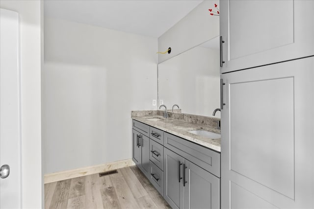 519 Abigail St, Dalton, GA 30721 - full bath featuring wood finished floors, double vanity, and baseboards