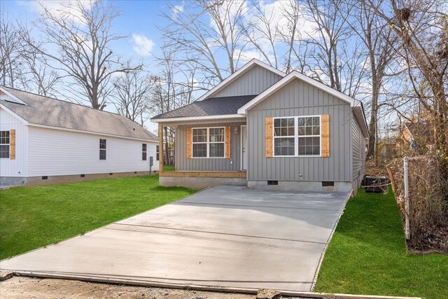 519 Abigail St, Dalton, GA 30721 - view of front of house featuring crawl space, board and batten siding, a porch, a front yard, and central AC unit