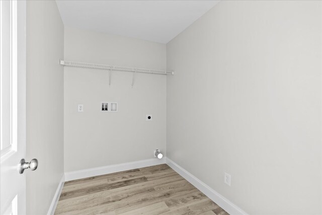 519 Abigail St, Dalton, GA 30721 - laundry area featuring electric dryer hookup, hookup for a washing machine, light wood-style flooring, and baseboards