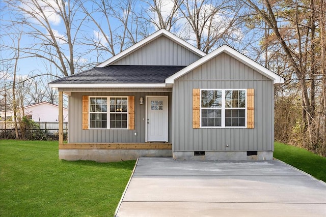 519 Abigail St, Dalton, GA 30721 - view of front of home featuring a shingled roof, covered porch, a front lawn, crawl space, and board and batten siding