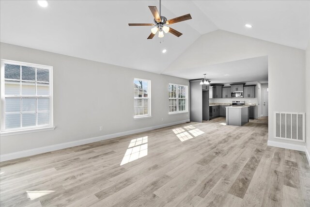 519 Abigail St, Dalton, GA 30721 - unfurnished living room featuring ceiling fan, high vaulted ceiling, recessed lighting, baseboards, and light wood-type flooring