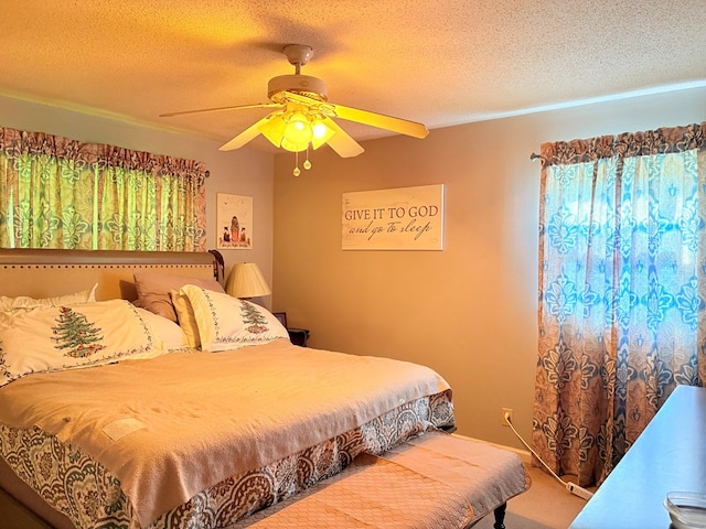 bedroom featuring a textured ceiling and ceiling fan