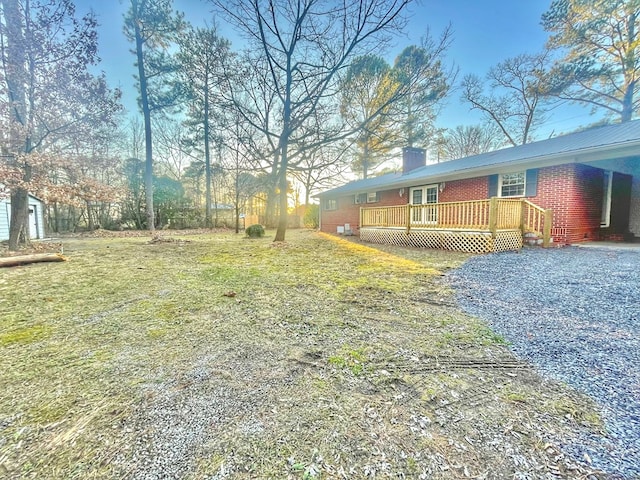 view of yard with a wooden deck