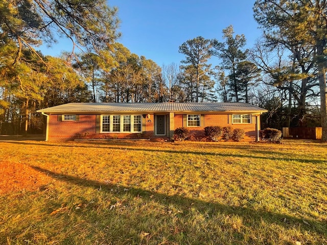 ranch-style house with a front lawn