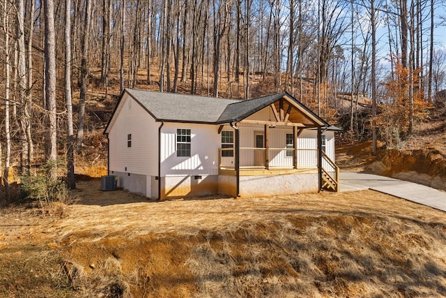 view of front of home featuring a porch and central air condition unit