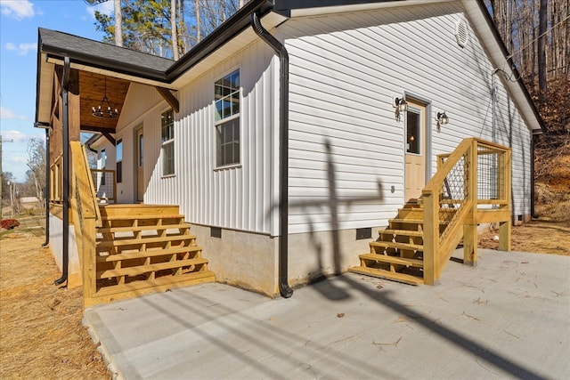 view of property exterior with a patio area