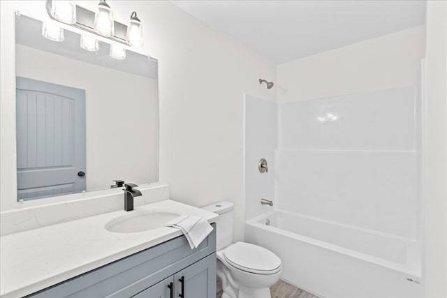 full bathroom with shower / washtub combination, toilet, and vanity