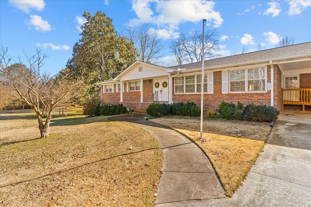 single story home with a front yard and a porch