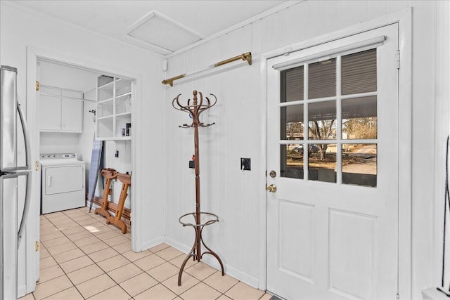 interior space featuring washer / dryer and light tile patterned flooring