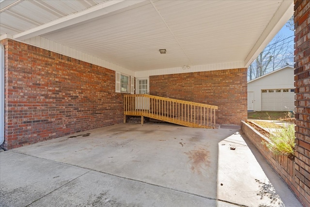 view of patio / terrace with a garage and an outdoor structure