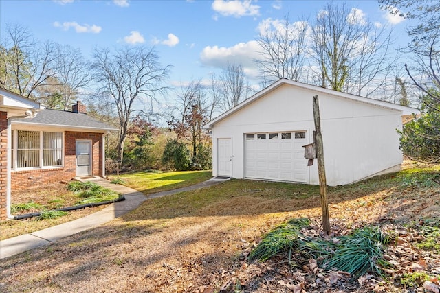 garage featuring a lawn