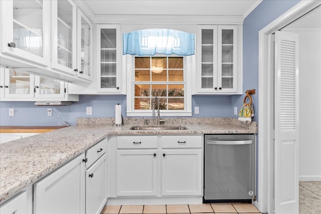 kitchen with sink, light stone counters, ornamental molding, dishwasher, and white cabinets