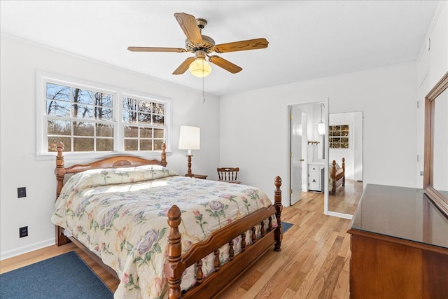 bedroom with light hardwood / wood-style floors and ceiling fan