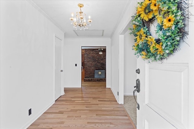 corridor featuring ornamental molding and light hardwood / wood-style floors