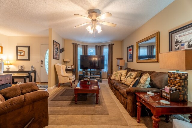 639 Mount View Dr, Tunnel Hill, GA 30755 - living room featuring a ceiling fan, a textured ceiling, and light carpet