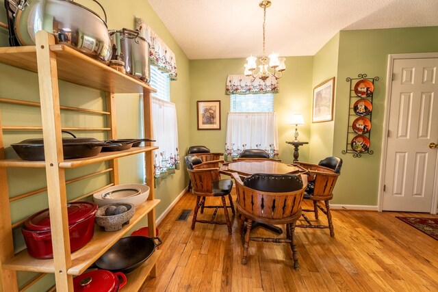 639 Mount View Dr, Tunnel Hill, GA 30755 - dining area with a chandelier, baseboards, and hardwood / wood-style flooring