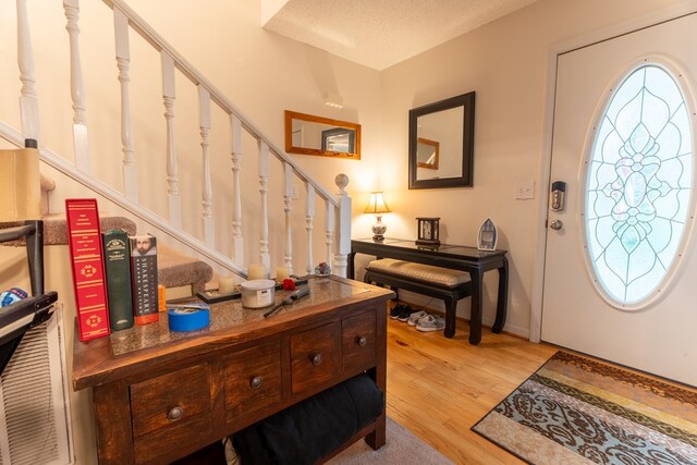 639 Mount View Dr, Tunnel Hill, GA 30755 - entryway with stairway, light wood-type flooring, and baseboards