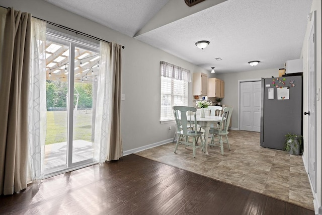 225 Shawn Ln, Chatsworth, GA 30705 - dining area featuring a textured ceiling, baseboards, and light wood-type flooring
