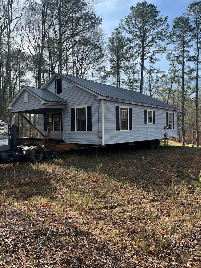 exterior space with metal roof
