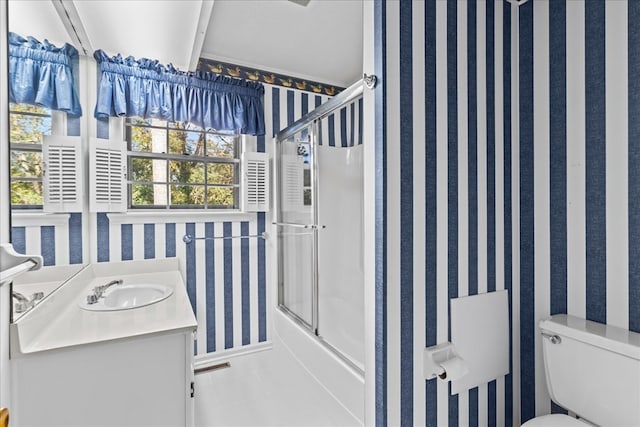 608 Brookview Ln, Dalton, GA 30720 - bathroom featuring wallpapered walls, combined bath / shower with glass door, tile patterned flooring, toilet, and vanity