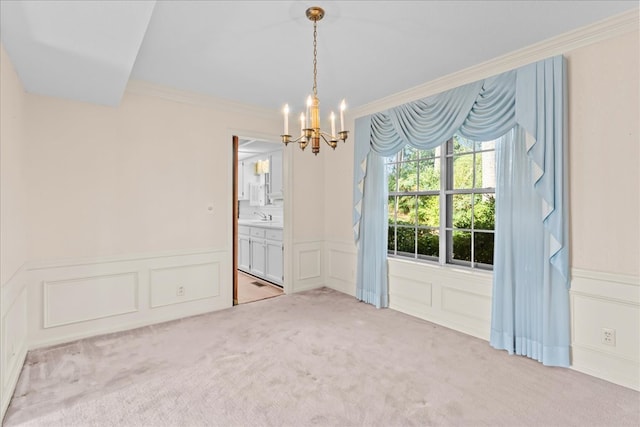608 Brookview Ln, Dalton, GA 30720 - empty room featuring a decorative wall, a chandelier, crown molding, a wainscoted wall, and light carpet