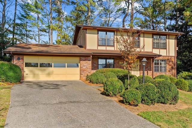 608 Brookview Ln, Dalton, GA 30720 - view of front of house featuring driveway, a garage, brick siding, and stucco siding
