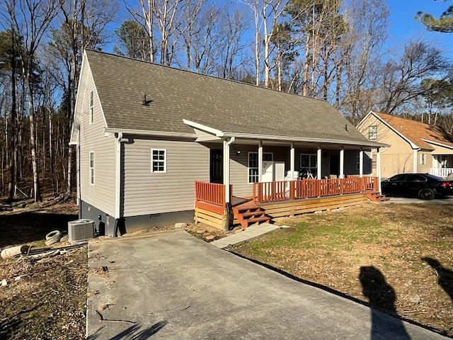 view of front of house featuring cooling unit and covered porch