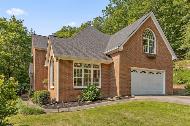 2001 Eagle Point Dr, Dalton, GA 30720 - traditional-style house featuring driveway, a shingled roof, an attached garage, brick siding, and a front yard