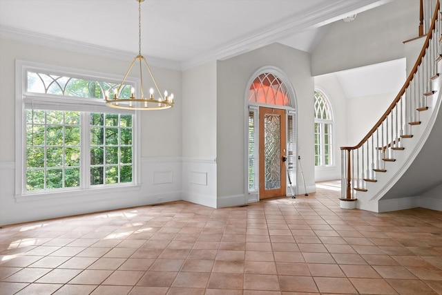 2001 Eagle Point Dr, Dalton, GA 30720 - foyer featuring plenty of natural light, stairway, a chandelier, crown molding, and vaulted ceiling