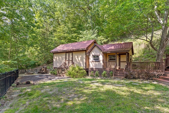 2001 Eagle Point Dr, Dalton, GA 30720 - view of front of home featuring metal roof and a wooded view
