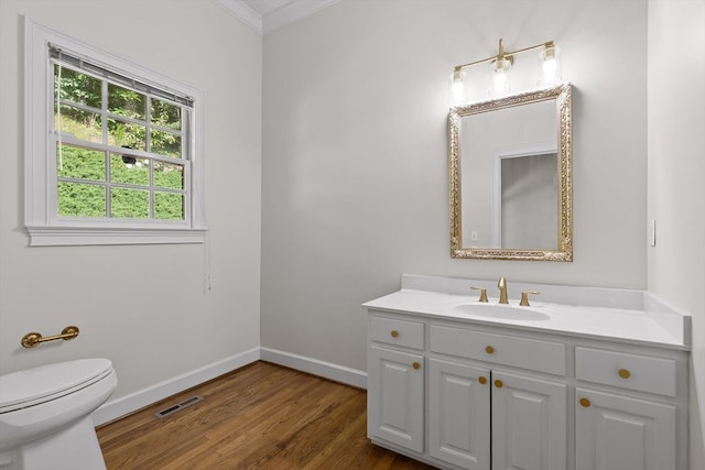 2001 Eagle Point Dr, Dalton, GA 30720 - bathroom featuring vanity, baseboards, wood finished floors, toilet, and crown molding